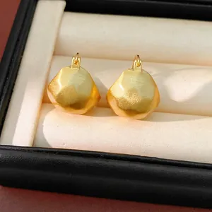 Minimalist brushed gold geometric semi-circle hoop earrings presented in a luxury box