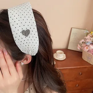 Elegant white polka dot wide pleated headband with heart rhinestone detail for women.