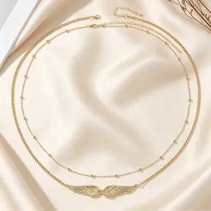 Elegant double-layer gold angel wing body chain with beads for sexy beach bikini style.