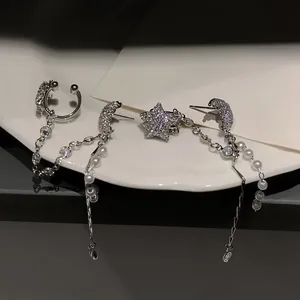 Celestial star and moon tassel earrings set with faux pearls and sparkling stones