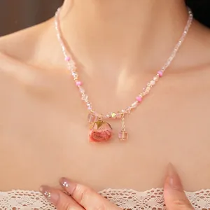 Handmade glass beaded necklace with dried rose pendant for a sweet aesthetic look