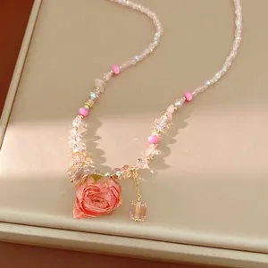 Sweet glass beaded necklace featuring a preserved rose pendant for elegant holiday outfits