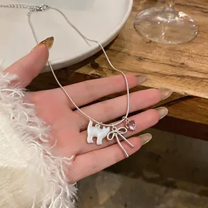 Elegant silver snake chain necklace featuring shell cat, bow, and pink heart charms