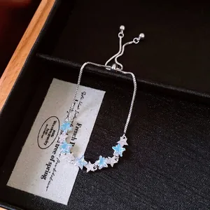 Bracelet étoile élégant en argent avec zircons bleus et chaîne réglable