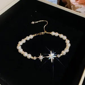Elegant 18k gold plated pearl bracelet featuring sparkling zircon star charm pendants