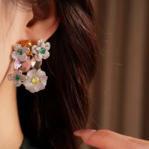 Vintage zircon flower earrings with colorful oval stones on ear