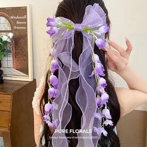Fermaglio per capelli a fiocco viola con mughetto e nappe di perle