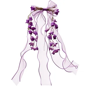 Elegante fermaglio per capelli viola con fiocco e mughetto per accessori moda quotidiani.
