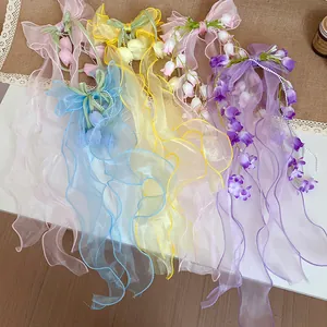 Collezione dettagliata di eleganti fermagli per capelli a fiocco con mughetto in vari colori