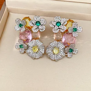 Macro detail of luxury vintage floral earrings with colorful gemstones and zirconia.