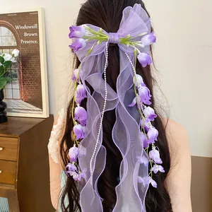Elegante fermaglio per capelli in organza viola decorato con mughetto artificiale