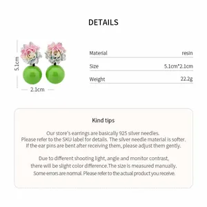 Detail chart showing size and material of floral resin stud earrings with green beads