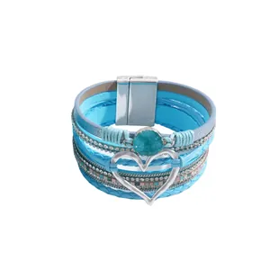 Blue multilayer leather wrap bracelet featuring rhinestone chains and silver heart charm