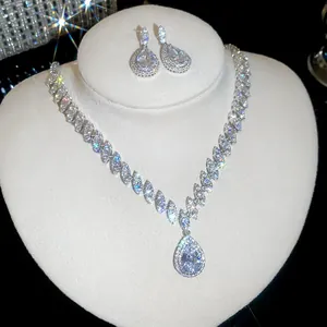 Exquisite luxury teardrop zircon necklace and earring set displayed on a white bust