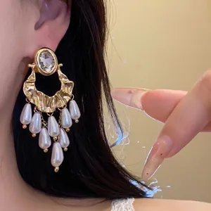 Vintage gold oval rhinestone earrings with elegant white pearl tassels and silver needles