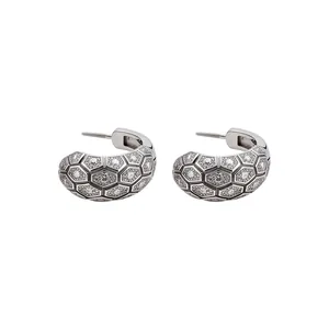 Elegant vintage 18k gold plated earrings featuring hexagonal grid and zirconia