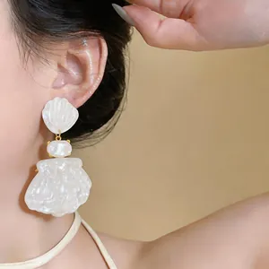 Elegant French palace style white shell drop earrings with a luxurious marble finish