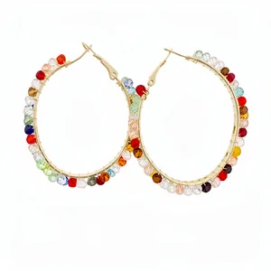 Fashionable gold-tone hoop earrings with vibrant multi-colored glass beads
