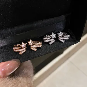 Sparkling zircon star ear clips for non-pierced ears available in rose gold and silver finishes.