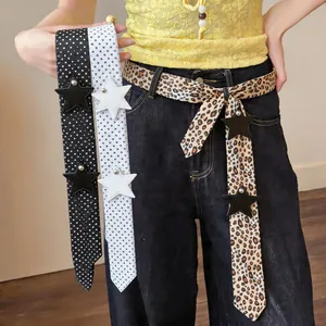 Close-up of stylish faux silk scarves with star leather patches in various patterns