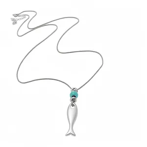 Minimalist silver matte fish pendant necklace with turquoise bead and long chain detail