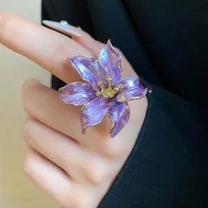 Close-up detail of a vintage purple tulip flower ring with gold-edged enamel petals