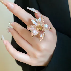 Detailed close-up of a vintage tulip-inspired adjustable ring on a finger