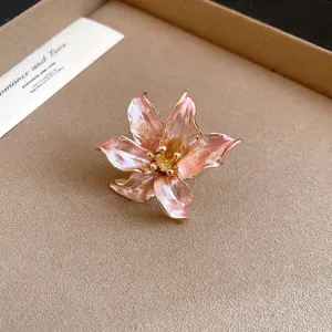 Macro view of a vintage pink tulip flower ring featuring elegant gold-toned edges