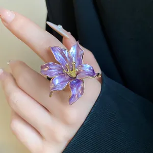 Detailed close-up of an elegant vintage purple tulip flower ring with refined gold edges