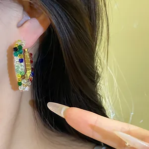 Detail of Korean fashion hoop earring with vibrant multicolored glass beads