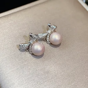 Pendientes de perlas con lazo de plata estilo francés de diseño elegante