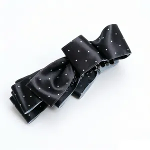 Elegant black satin polka dot bow twist hair clip for a sophisticated look