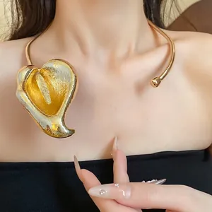 Elegant vintage gold calla lily flower collar necklace for women worn by a model