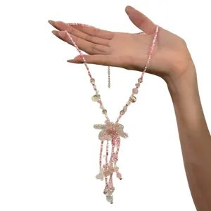 Sweet pink flower beaded necklace with tassels and peach-colored beads for women