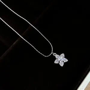 Macro detail of a sparkling star-shaped zirconia pendant on a silver necklace chain