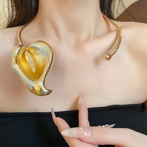 Detailed view of an elegant vintage gold calla lily choker necklace on a model's neck.