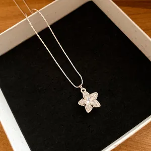 Close-up of a sparkling star pendant necklace with zirconia in a jewelry box