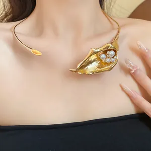 Close-up detail of an elegant gold calla lily choker necklace with white pearls