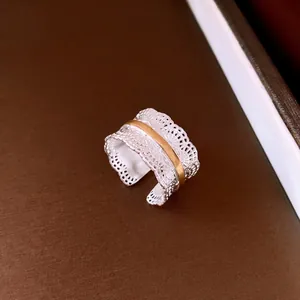 Elegant vintage lace hollow open ring featuring a dual-tone gold and silver finish.