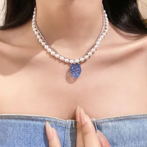 Elegant double-layer pearl and rhinestone necklace with blue resin grape pendant