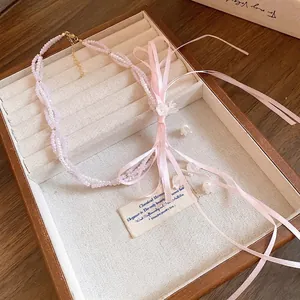Elegant sweet pink beaded necklace with silk ribbon bow and flower tassel details