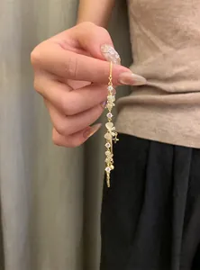 Detailed shot of 18K gold plated bracelet featuring zircon butterflies and adjustable slider