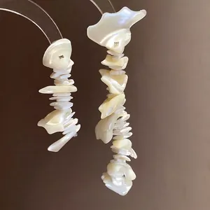 Elegant bohemian shell tassel earrings with iridescent mother-of-pearl flakes