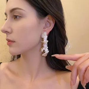 Bohemian irregular shell tassel earrings with iridescent finish for resort style