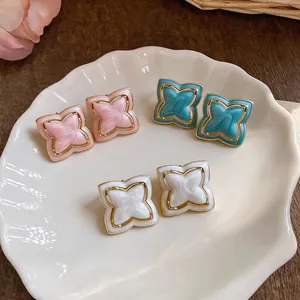 Elegant Korean style enamel star flower stud earrings in pink, blue, and white colors for women