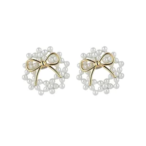 Elegant 14k gold plated silver needle bow pearl stud earrings with a wreath design