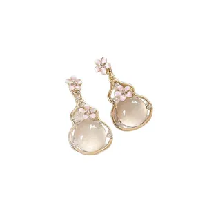 Elegant gourd-shaped drop earrings with pink flowers and cat eye stone on white background.