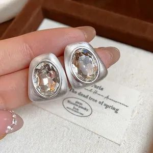 Elegant irregular geometric matte silver earrings with large oval crystal for women