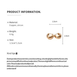 Detail view of gold starburst engraved hoop earrings with size and weight specs
