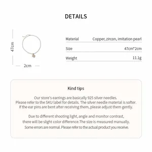 Detailed view of pearl necklace with flower pendant including size and material info